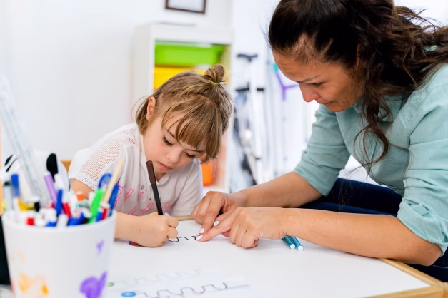 Image of Person Doing ABA Behavior Therapy for a child with autism.
