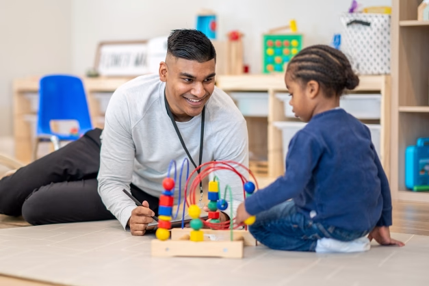 Image of Person Doing Occupational Therapy for a child with autism.